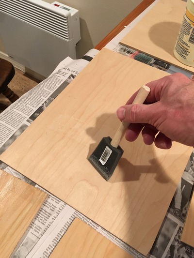 Applying size to a painting panel