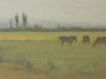 A painting of horses grazing in a field