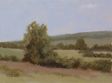 This plein air painting was re-worked in the studio. The landscape was painted with analogous colors set against a pale blue sky.