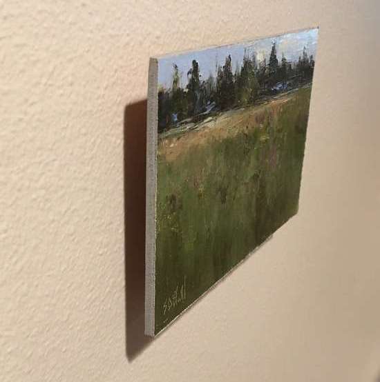 A painting panel offset from a wall creates a drop shadow.