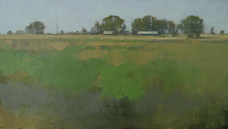 An oil painting by Simon Bland of two farm buildings set in a field of broken colors. There are trees on the horizon and a duck egg green sky..